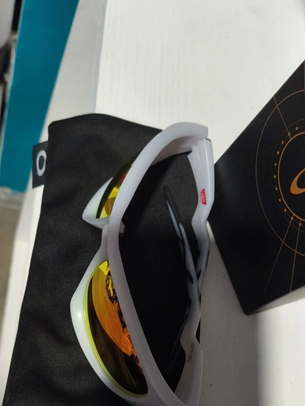 Oakley Clear Frame Sunglasses with Ruby-Red Polarized Lenses